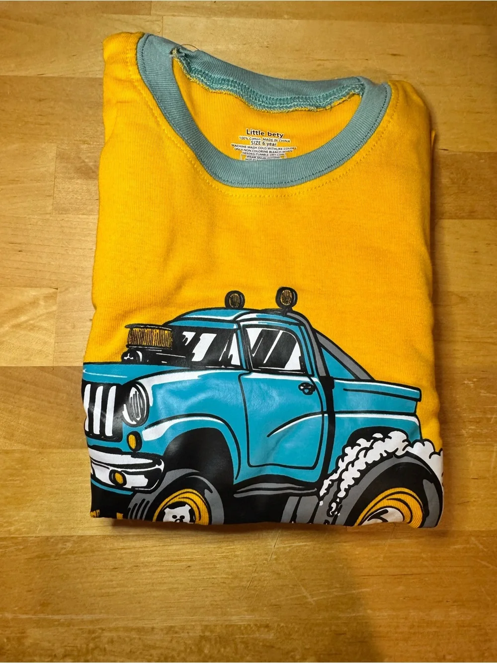 Yellow Monster Truck Pajama Set with blue Trim
